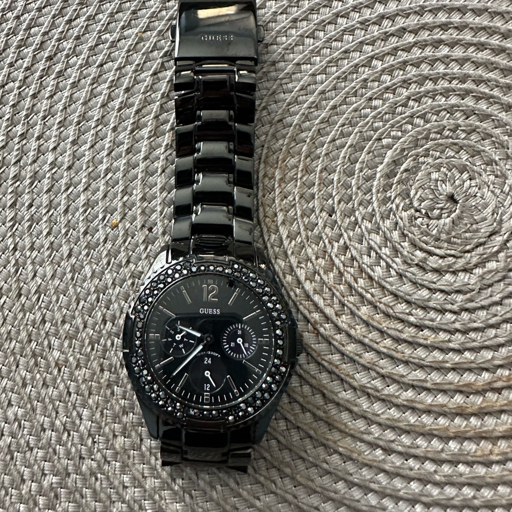 Women’s black Guess Watch.